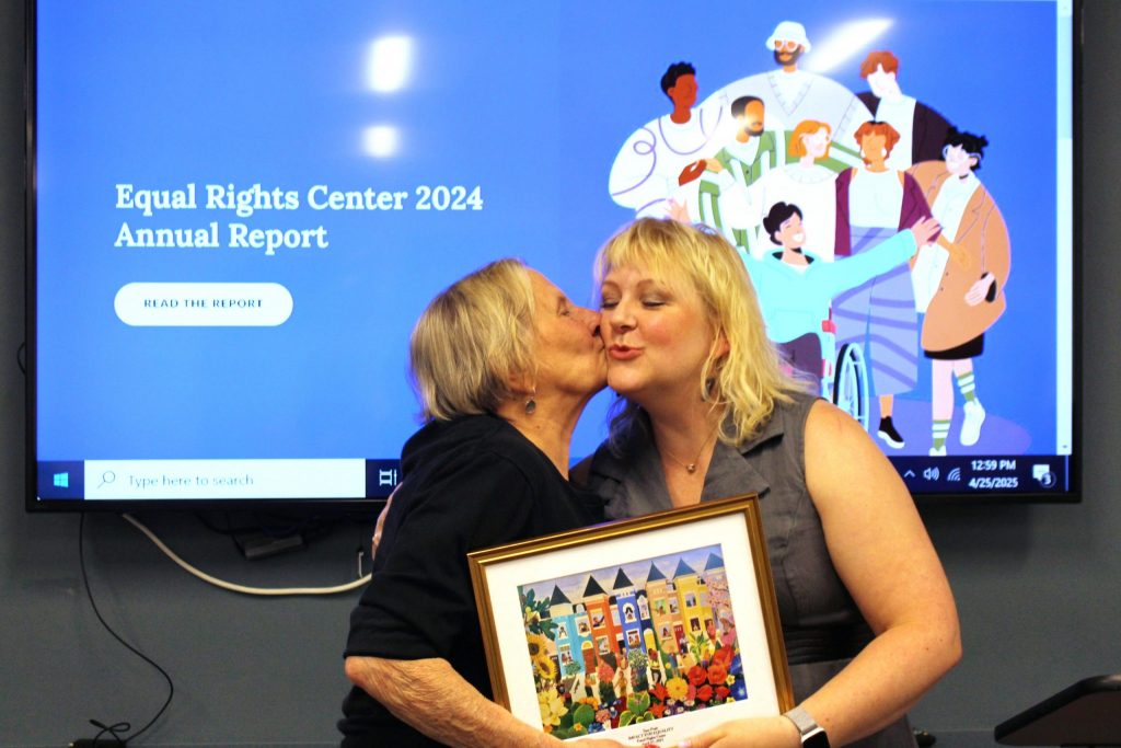 Kate Scott presents the Impact for Equality award to Sara Pratt at the ERC's 2025 Annual Meeting.