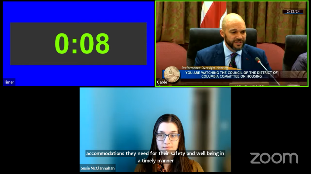 ERC Senior Fair Housing Rights Program Manager testifies to D.C. Council via Zoom. She appears in one box below Councilmember Robert White and another box displaying a timer.